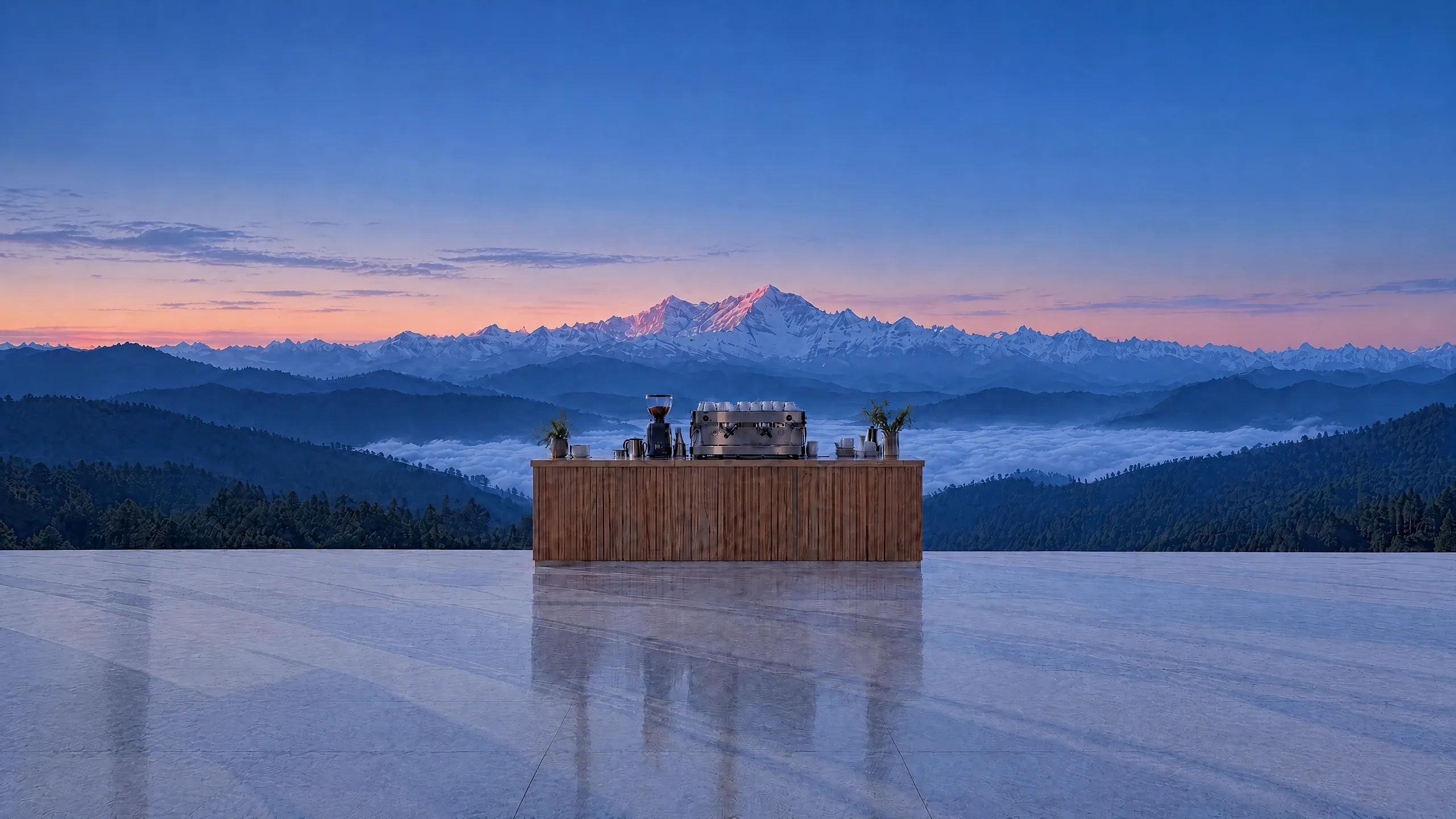Dawn from the café entrance: the counter on the open ridge, the Himalayan snow range beyond; the glass room gathers round it